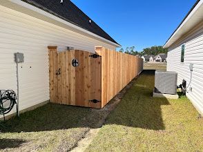 Wood privacy fence with custom side gate